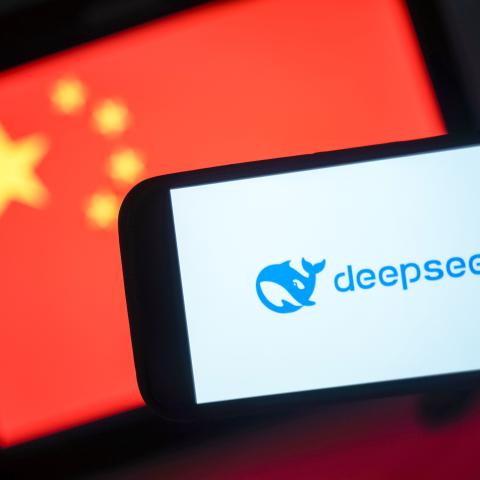 The DeepSeek logo is seen on a phone in front of a flag of China on January 28, 2025, in Hong Kong, China. (Anthony Kwan via Getty Images)