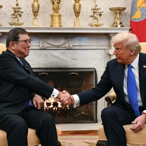 US President Donald Trump shakes hands with with Japanese Prime Minister Shigeru Ishiba in the Oval Office of the White House in Washington, DC, on February 7, 2025. (Photo by Jim WATSON / AFP) (Photo by JIM WATSON/AFP via Getty Images)