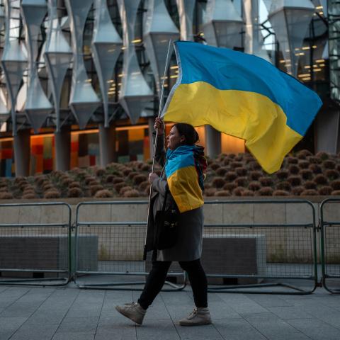 A woman carries a Ukrainian flag during a rally outside the United States embassy on March 5, 2025, in London, England. (Carl Court via Getty Images)