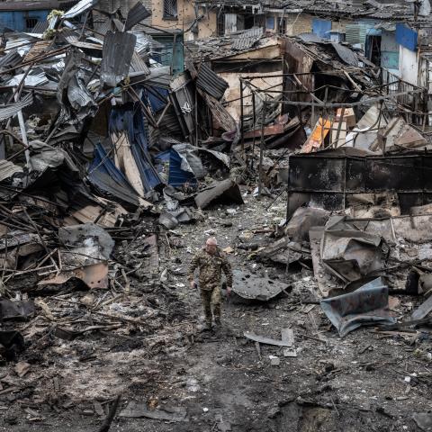 Ukrainian military walk through the destruction after a large scale Russian attack on a residential complex on March 7th that killed 11 people and injured 47 on March 10, 2025 in Dobropillia, Ukraine. U.S. President Donald Trump's recent decision to pause intelligence sharing with Kyiv has sparked concerns in Ukraine that Russian missile strikes could now strike cities without prior warning. (Photo by Paula Bronstein / Getty Images)