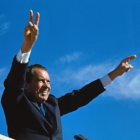 Richard Nixon gives his well-known two-armed victory salute during a campaign stop in El Paso. (Getty Images)