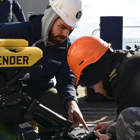 Royal Australian Navy sailors perform maintenance on a remotely operated vehicle during the Australia, UK, and US (AUKUS) Pillar II Subsea and Seabed Warfare Event Two / Integrated Battle Problem 25.1 on December 6, 2024, in the Atlantic Ocean. (US Navy photo)