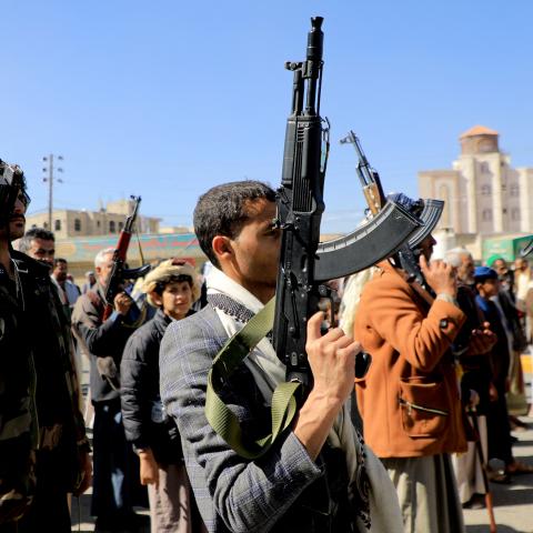 Houthi fighters brandish their weapons during a march in solidarity with the Palestinian people in the Houthi-controlled capital Sanaa on January 11, 2024. (Mohammed Huwais/AFP via Getty Images)