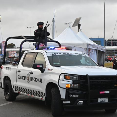 A Mexican National Guard officer stands guard on a pickup truck during a vehicle check heading to the United States at the San Ysidro Port of Entry crossing in Tijuana, Baja California, Mexico, on February 6, 2025. (Getty Images)