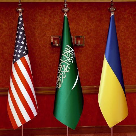 The flags of the United States, Saudi Arabia, and Ukraine are seen prior to talks on March 11, 2025, in Jeddah, Saudi Arabia. (Salah Malkawi via Getty Images)
