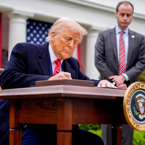President Donald Trump signs executive orders imposing tariffs on imported goods during a trade announcement event at the White House on April 2, 2025, in Washington, DC. (Andrew Harnik via Getty Images)