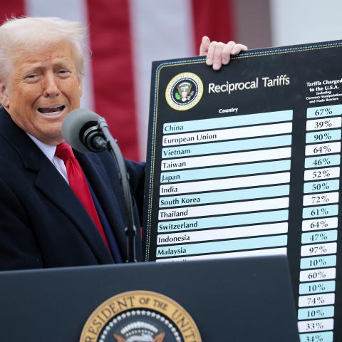 U.S. President Donald Trump holds up a chart while speaking during a “Make America Wealthy Again” trade announcement event in the Rose Garden at the White House on April 2, 2025 in Washington, DC. Touting the event as “Liberation Day”, Trump is expected to announce additional tariffs targeting goods imported to the U.S. (Photo by Chip Somodevilla/Getty Images)