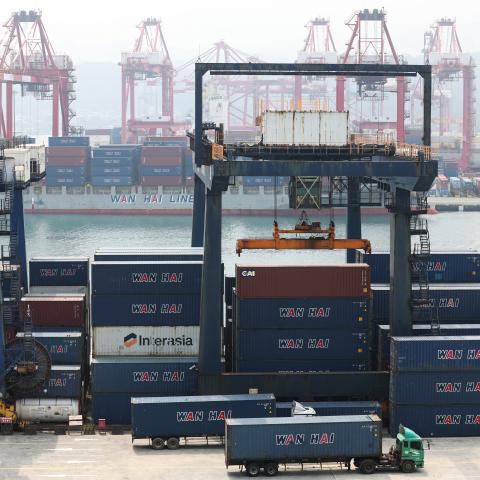 Shipping containers and cranes are seen at the port in Keelung, Taiwan, on April 9, 2025. (I-Hwa Cheng/AFP via Getty Images) 