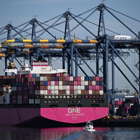 Cranes unload cargo shipping containers from the ONE Hannover container ship at the Port of Los Angeles in San Pedro, California, on April 10, 2025. (Patrick T. Fallon/AFP via Getty Images)