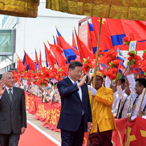 China’s President Xi Jinping and Cambodia’s King Norodom Sihamoni greet people at Phnom Penh International Airport as Beijing seeks to strengthen regional trade ties and offset the impact US tariffs. (Getty Images)
