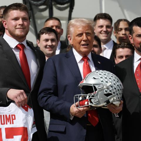 President Donald Trump stands with Ohio State Head Coach Ryan Day as he welcomes the 2025 College Football National Champions from Ohio State University to the White House during a ceremony on the south lawn on April 14, 2025. (Getty Images)