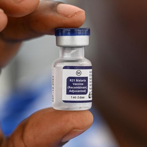 A health worker displays a bottle containing the vaccine against malaria during the launch of a vaccination campaign for children in Abidjan, Côte d’Ivoire, on July 15, 2024. (Sia Kambou via Getty Images)