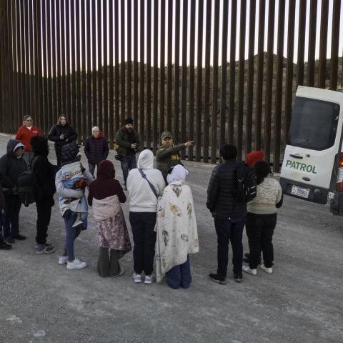 Immigrants wait to be transported by US Border Patrol agents after crossing the US-Mexico border on January 20, 2025, near Sasabe, Arizona. (John Moore via Getty Images)