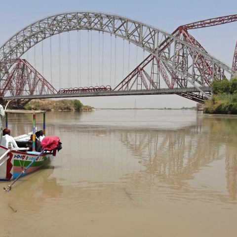 People take a boat ride in the waters of Indus River near the Lansdowne Bridge in Sukkur, Pakistan, on April 28, 2025. (Shahid Ali via Getty Images)