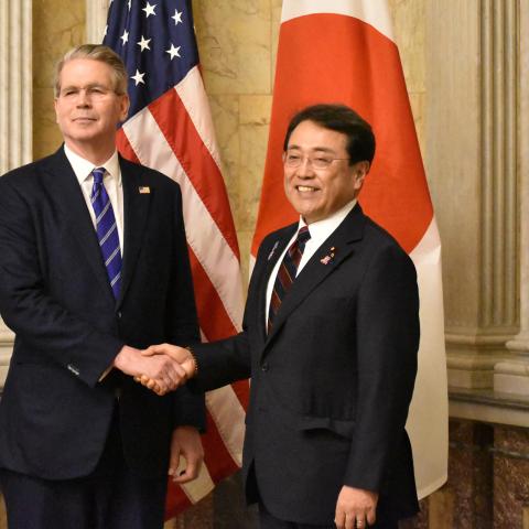 Japan's Economic Revitalisation Minister Ryosei Akazawa poses with US Treasury Secretary Scott Bessent and Commerce Secretary Howard Lutnick in Washington, DC on May 1, 2025. (STR/JIJI Press/AFP via Getty Images)