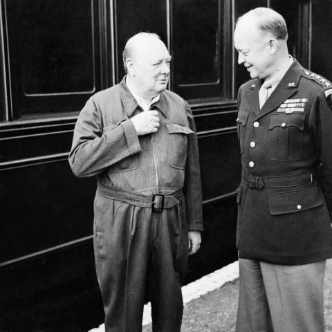 Winston Churchill shows off his famous “siren suit” to General Dwight D Eisenhower during a tour of Allied invasion forces in Kent, England, on May 12, 1944 (Wikimedia Commons).