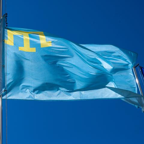 The Crimean Tatar flag flies on a flagpole in front of the Lviv Oblast Military Administration on May 17, 2024, in Lviv, Ukraine. (Stanislav Ivanov via Getty Images)
