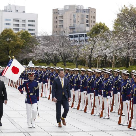 Minister of Defense of Japan Gen Nakatani, left, and U.S. Defense Secretary Pete Hegseth, right, review an honor guard during a welcome ceremony at the Ministry of Defense on March 30, 2025 in Tokyo, Japan. (Kiyoshi Ota Getty Images)