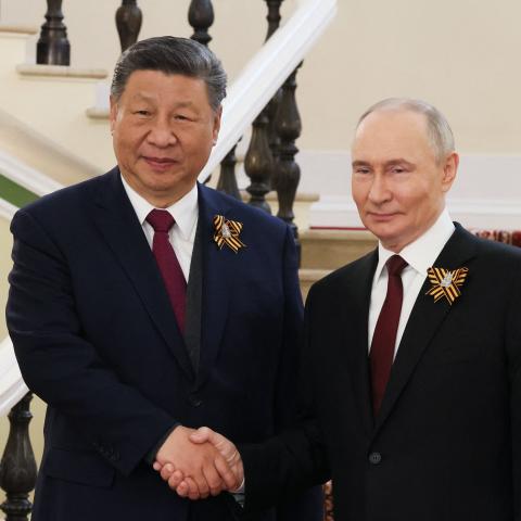 Russia's President Vladimir Putin greets Chinese President Xi Jinping in Moscow on May 9, 2025. (Mikhail Metzel via Getty Images)