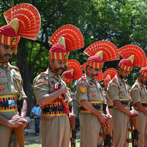 Border Security Force soldiers pay respect during a wreath-laying ceremony for Constable Deepak Chingakham of the Border Security Force, who was killed during a cross-border firing between India and Pakistan in Jammu on May 12, 2025. (Money Sharma via Getty Images)