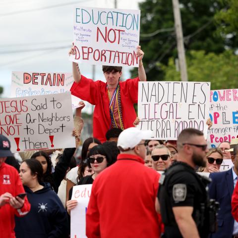 Milford High School graduates protest outside of Milford Town Hall a day after 18-year-old Marcelo Gomes Da Silva was detained by ICE on his way to volleyball practice. (Jessica Rinaldi via Getty Images)