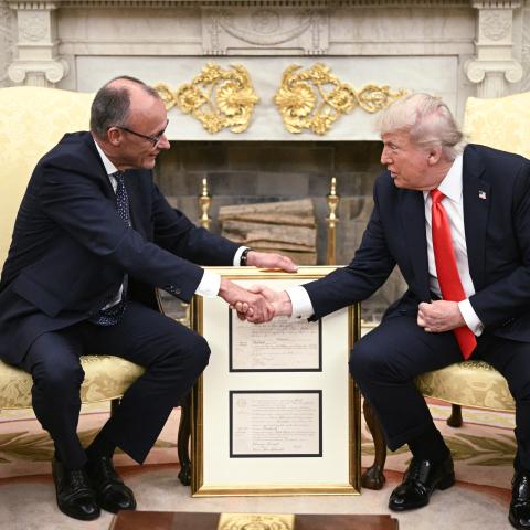 US President Donald Trump and German Chancellor Friedrich Merz shake hands during a bilateral meeting in the Oval Office of the White House in Washington, DC, on June 5, 2025. (Brendan Smialowski via Getty Images)