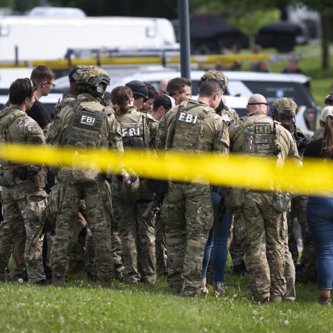 FBI agents stage in a neighborhood on June 15, 2025, in Green Isle, Minnesota as law enforcement agencies search for Vance Boelter. (Christopher Mark Juhn via Getty Images)