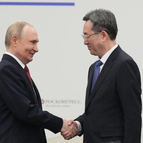 Russia's President Vladimir Putin shakes hands Chinese Vice Premier Ding Xuexiang during the Saint Petersburg International Economic Forum in Saint Petersburg on June 20, 2025. (Dmitry Lovetsky via Getty Images)