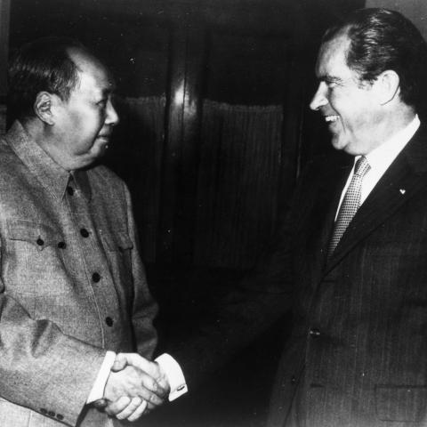 Chinese Chairman Mao Zedong shakes hands with US President Richard Nixon in Beijing during his visit to China. (Getty Images)