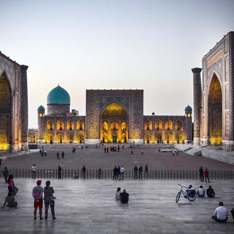 People walk in Registan Square in downtown Samarkand on September 13, 2022. A regional summit this week where Russian President Vladimir Putin will meet China's Xi Jinping and other Asian leaders will showcase an "alternative" to the Western world, the Kremlin said. Putin and Xi will be joined by the leaders of India, Pakistan, Turkey, Iran and several other countries for the summit of the Shanghai Cooperation Organisation (SCO) in the Uzbek city of Samarkand on 15-16 September 2022. (Photo by Alexander NEM