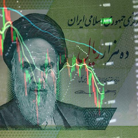 Iranian rials banknote on the background of stock charts. (Anton Petrus via Getty Images)