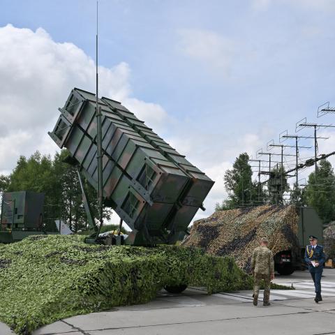 Ukrainian servicemen walk past a Patriot air defense system at an undisclosed area on August 4, 2024. (Sergei Supinsky via Getty Images)