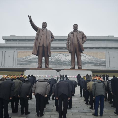 People pay tribute to the statues of late North Korean leaders Kim Il Sung and Kim Jong Il in Pyongyang on February 16, 2025. (Kim Won Jin via Getty Images)