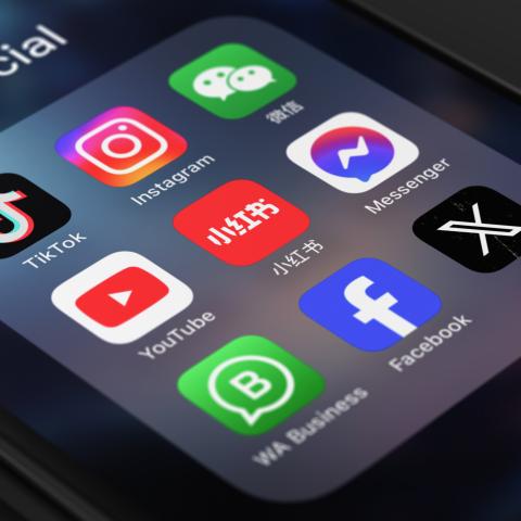 Icons for Tiktok, Instagram, Facebook, Xiaohongshu, Youtube, and WeChat are seen on a phone. (Getty Images)
