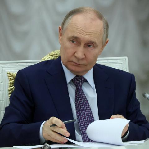 Russian President Vladimir Putin listens during a meeting on the development of occupied regions of Ukraine at the Kremlin on June 30, 2025. (Getty Images)
