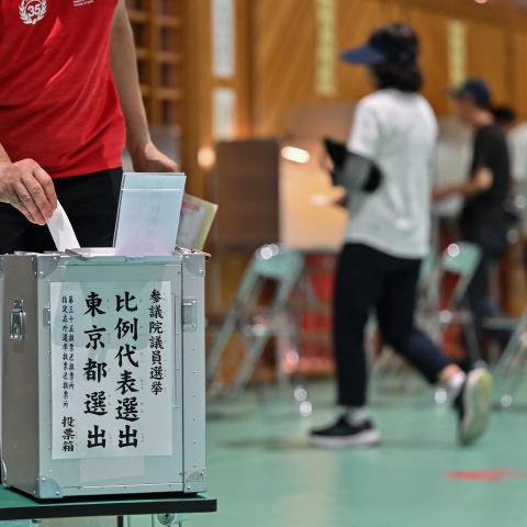 Voters take part in upper house elections at a polling station in Tokyo on July 20, 2025. Japanese Prime Minister Shigeru Ishiba faces a reckoning from voters with upper house elections on July 20 that could end his premiership and see a right-wing populist party make inroads. (Photo by Richard A. Brooks / AFP) (Photo by RICHARD A. BROOKS/AFP via Getty Images)