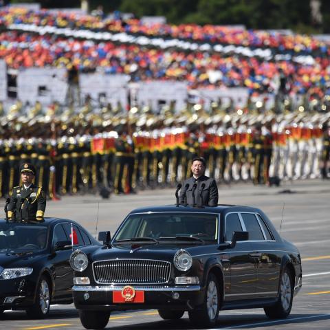 Chinese President Xi Jinping inspects troops during a parade commemorating the seventieth anniversary of the end of World War II in Beijing on September 3, 2015. (Huang Xiaobang via Getty Images)