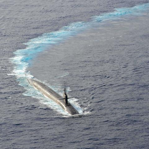 The Ohio-class ballistic-missile submarine USS Kentucky maneuvers during a routine armed air escort exercise on April 24, 2025. (US Navy photo)