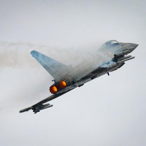 A Eurofighter Typhoon aircraft climbs with afterburners engaged during a flight demonstration at the Royal International Air Tattoo at RAF Fairford in England on July 19, 2025. (US Air Force photo)
