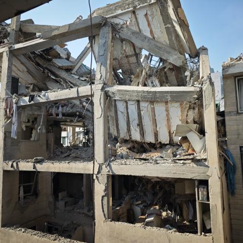 People look over damage to buildings following Israeli airstrikes on June 13, 2025, in Tehran, Iran. (Majid Saeedi via Getty Images)