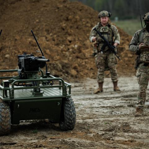 Ukrainian military personnel control the unmanned ground vehicle platform Rys Pro equipped with a remote-controlled machine-gun turret during training on April 18, 2025, in an unspecified area of Ukraine. (Serhii Mykhalchuk via Getty Images)