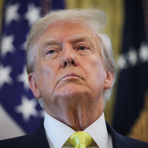 US President Donald Trump listens to questions from reporters after speaking on economic data in the Oval Office on August 7, 2025, in Washington, DC. (Win McNamee via Getty Images)