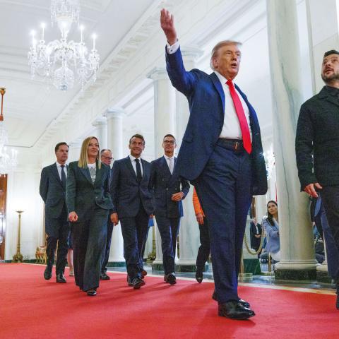 President Donald Trump leads President Volodymyr Zelenskyy and other European leaders in the Cross Hall of the White House on August 18, 2025. (Aaron Schwartz via Getty Images)