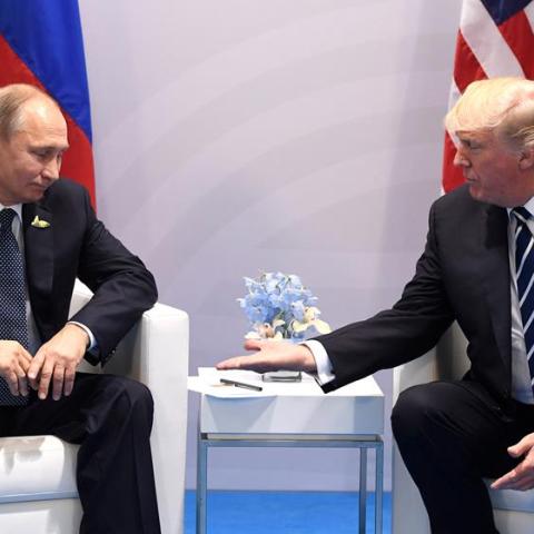 US President Donald Trump and Russia's President Vladimir Putin shake hands during a meeting on the sidelines of the G20 Summit in Hamburg, Germany, on July 7, 2017. (Photo by SAUL LOEB / AFP) (Photo by SAUL LOEB/AFP via Getty Images)