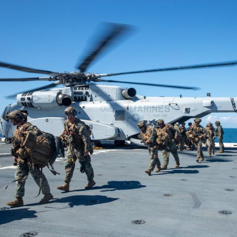 US Marines embark on the amphibious transport dock ship USS Arlington from a CH-53K helicopter on September 25, 2025. (US Navy)