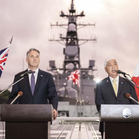 Australia’s Defence Minister Richard Marles and Japan’s Defence Minister General Nakatani shake hands ahead of a joint press announcement aboard the Japan Maritime Self-Defense Force Mogami-class stealth frigate JS Mikuma at the JMSDF naval base in Yokosuka, Japan, on September 5, 2025. (Getty Images)