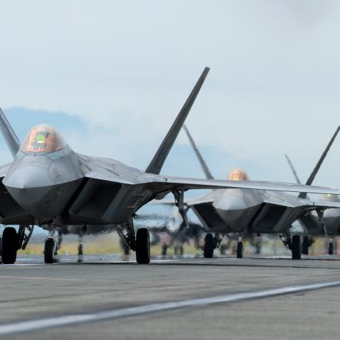 The U.S. Air Force 354th Air Expeditionary Wing and Marine Aircraft Group 12 performed a capabilities demonstration during a pre-planned readiness exercise at Marine Corps Air Station Iwakuni, Japan, July 7, 2022. The demonstration included U.S. Marine Corps F/A-18 Hornets, F-35B Lighting IIs, KC-130J Super Hercules aircraft, and U.S. Air Force F-22 Raptors and F-35A Lighting II aircraft, showcasing a high level of readiness and joint service capability in support of a free and open Indo-Pacific. (U.S. Mari
