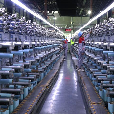 OCTOBER 14: Workers check the operation of carbon fiber production line at Zhongfu Shenying Carbon Fiber Co., Ltd. on October 14, 2025 in Xining, Qinghai Province of China. (Photo by Zhang Zhongping/VCG via Getty Images)
