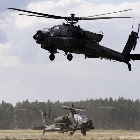 AH-64 Apache helicopters depart a forward arming and refueling point to conduct aerial gunnery tables at Pabradė Training Area in Lithuania on September 9, 2025. (US Army)