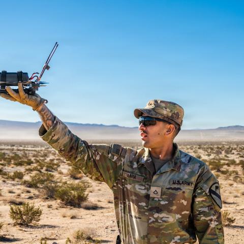 A US infantryman releases a Neros Archer small unmanned aircraft system for a test flight at the Fort Irwin in California on October 25, 2025. (US Army)